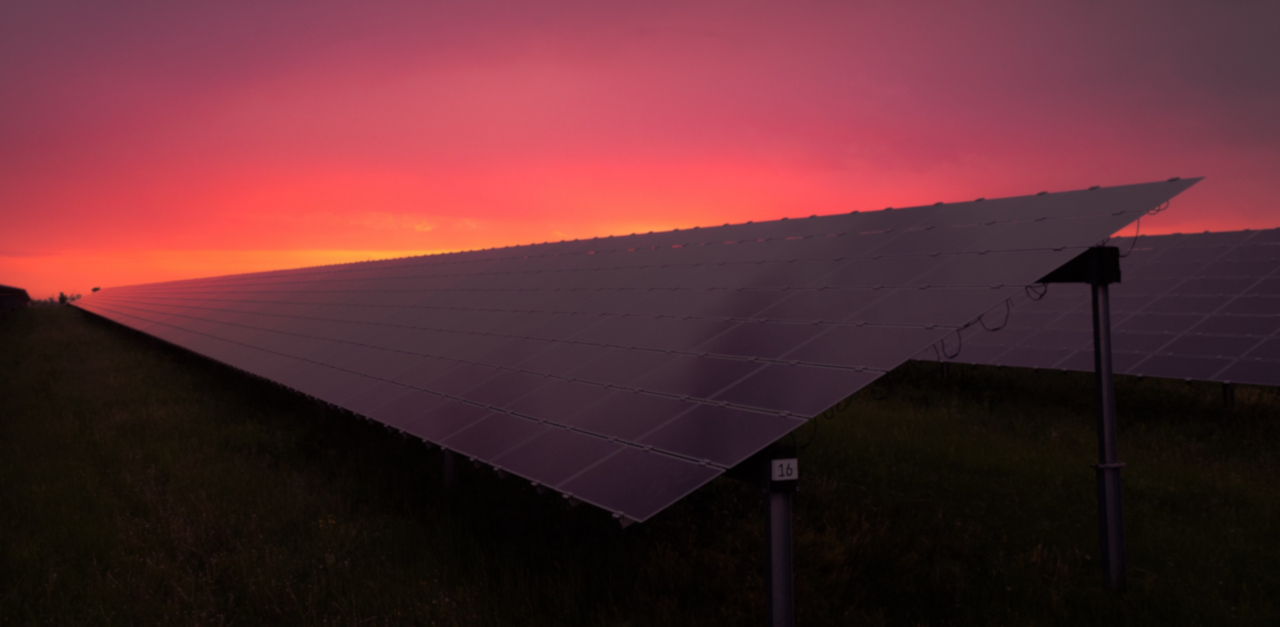The image shows eight EU flags in front of the Berlaymont building in Brussels, which houses the headquarters of the EU commission.